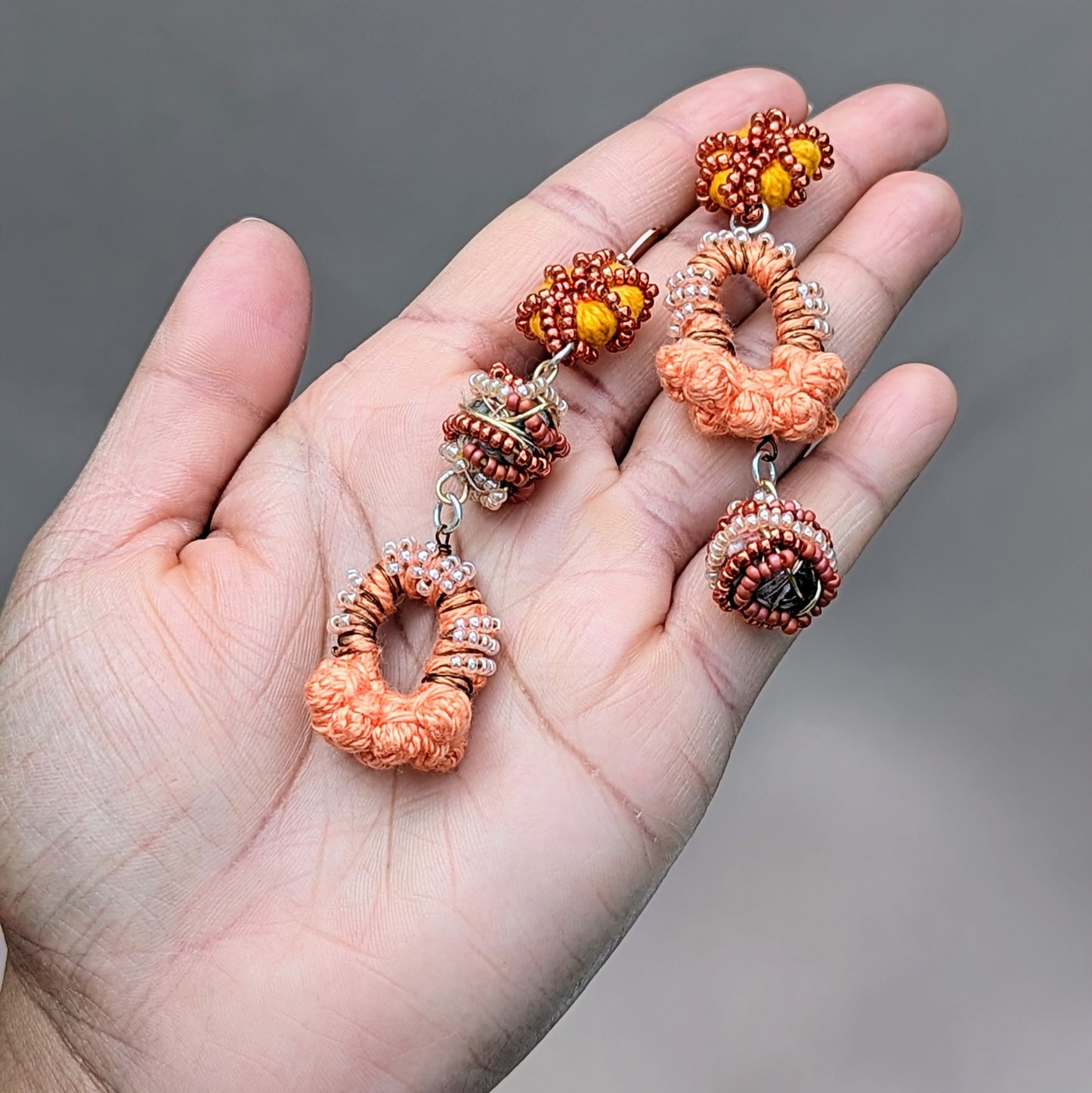 Sustainable scrap bead Indian earrings with crochet and bead embroidery.
