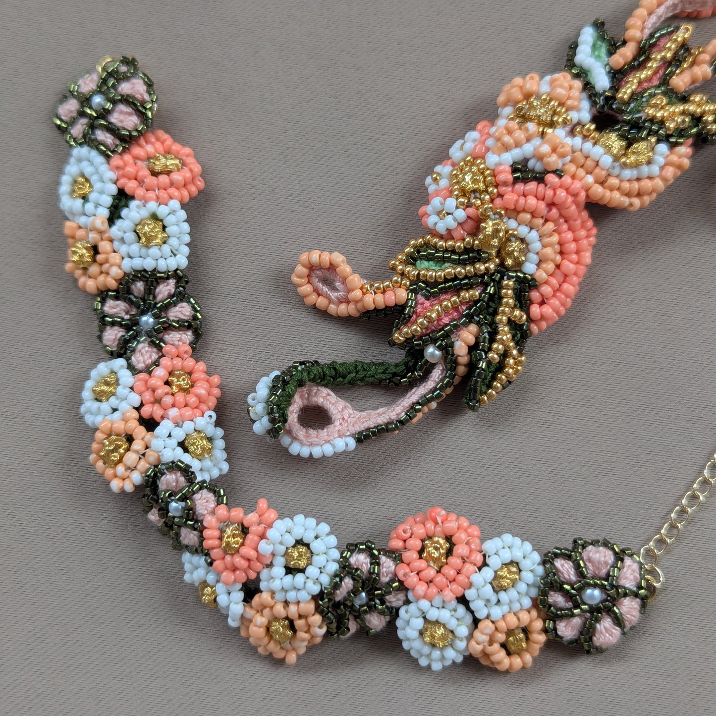 Close up view of the Padmika 5-in-1 Mayaani hand bracelet featuring detachable centre piece richly embroidered by hand in the UK.