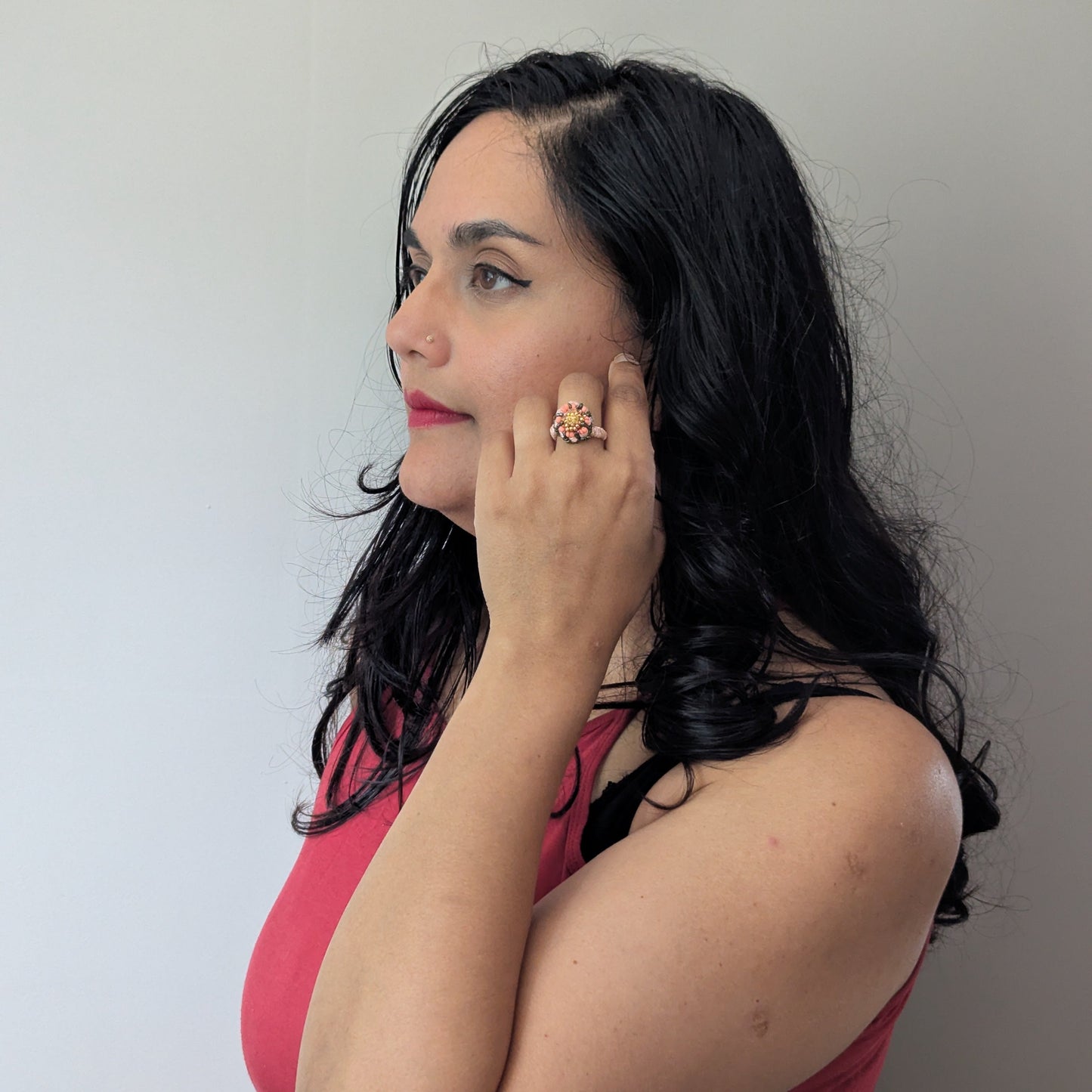 The Padmika 5-in-1 ring element worn by Megha of Mayaani Jewellery pictured in side profile shot against a neutral grey backdrop.