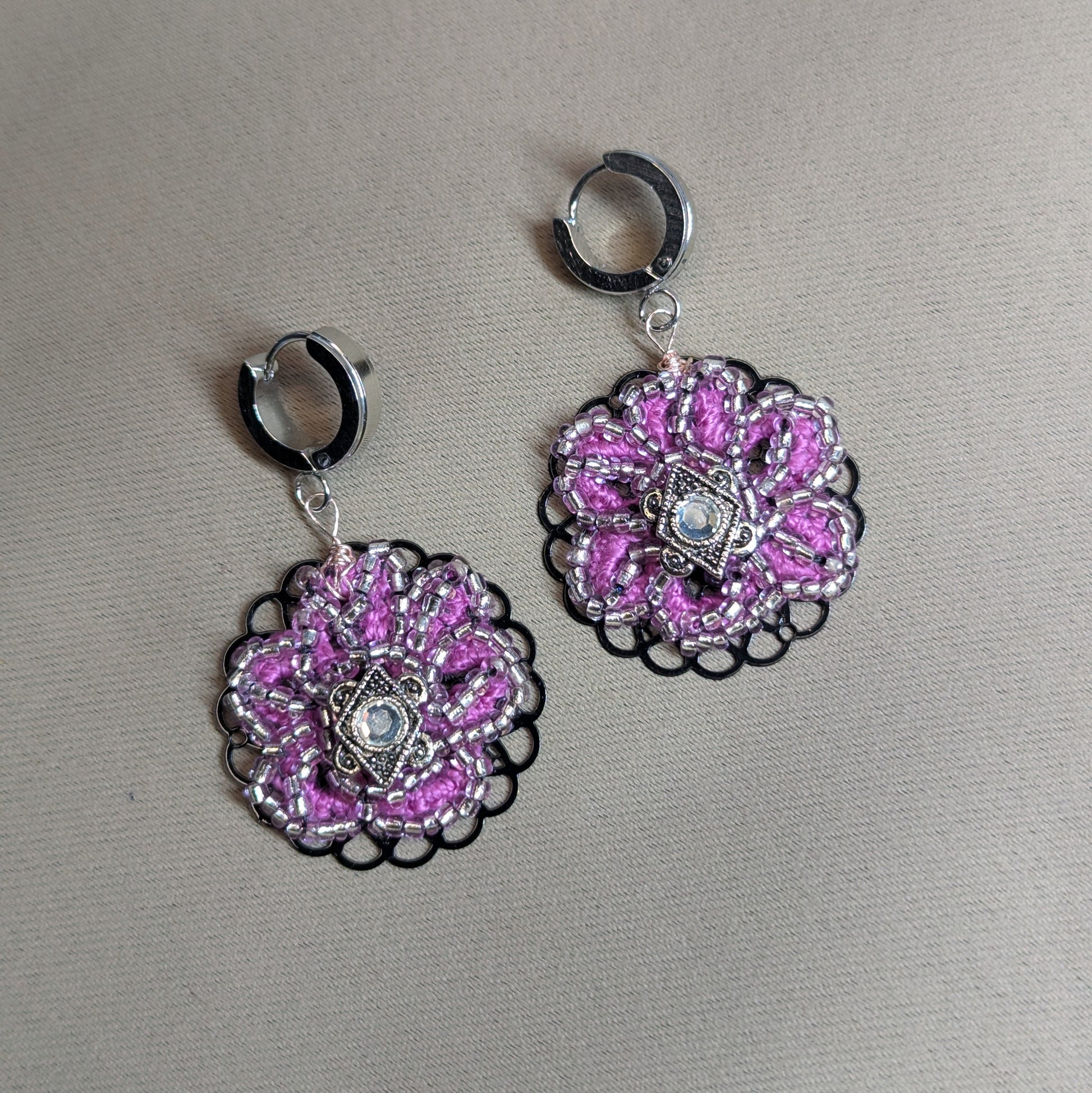 Detailed view of silver-lined Japanese beads and rose gold wire on Vanya earrings.