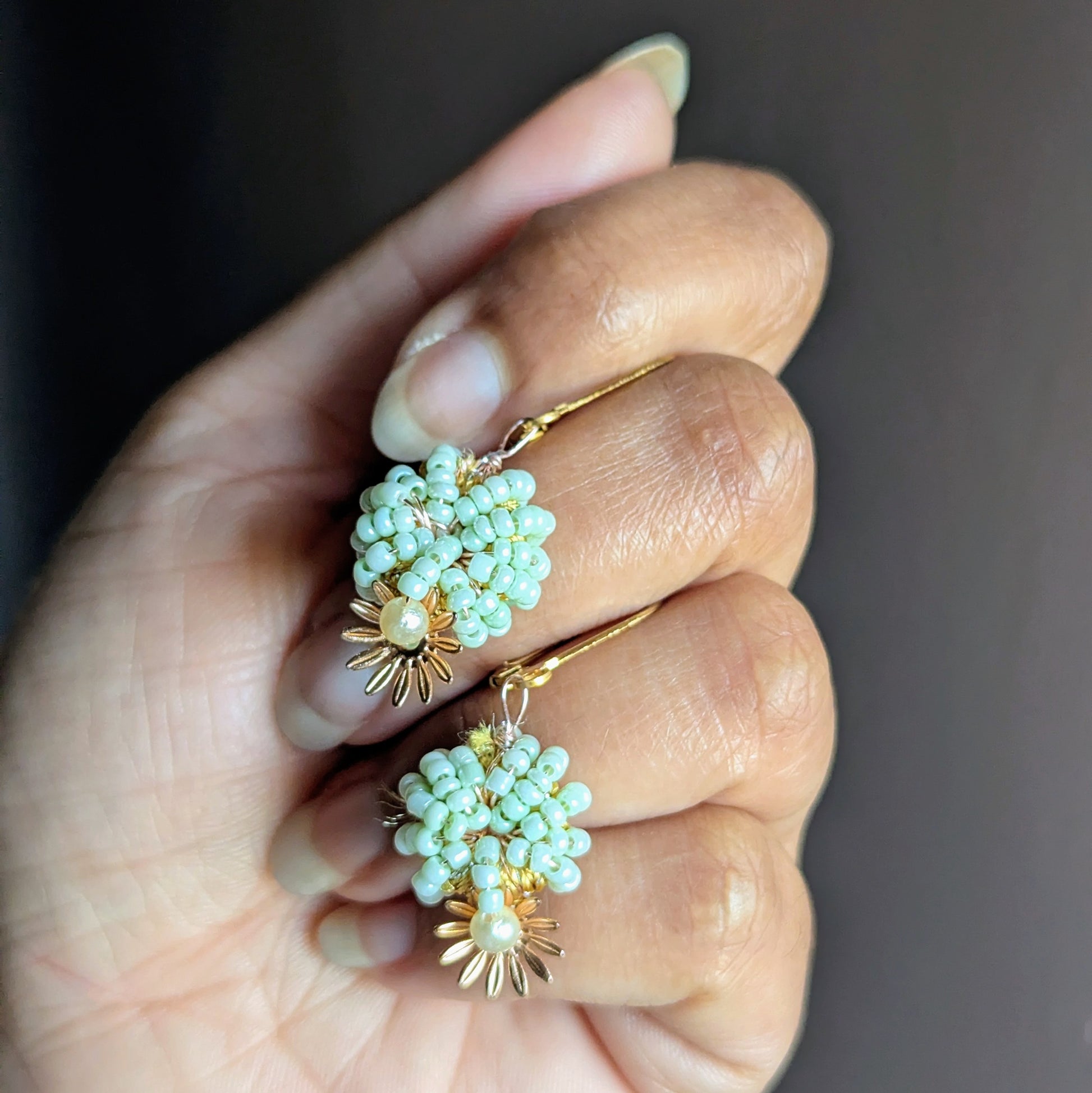 Handcrafted mint green and pearl beaded earrings with gold lever-back clasps, one-of-a-kind sustainable design by Mayaani Jewellery UK.