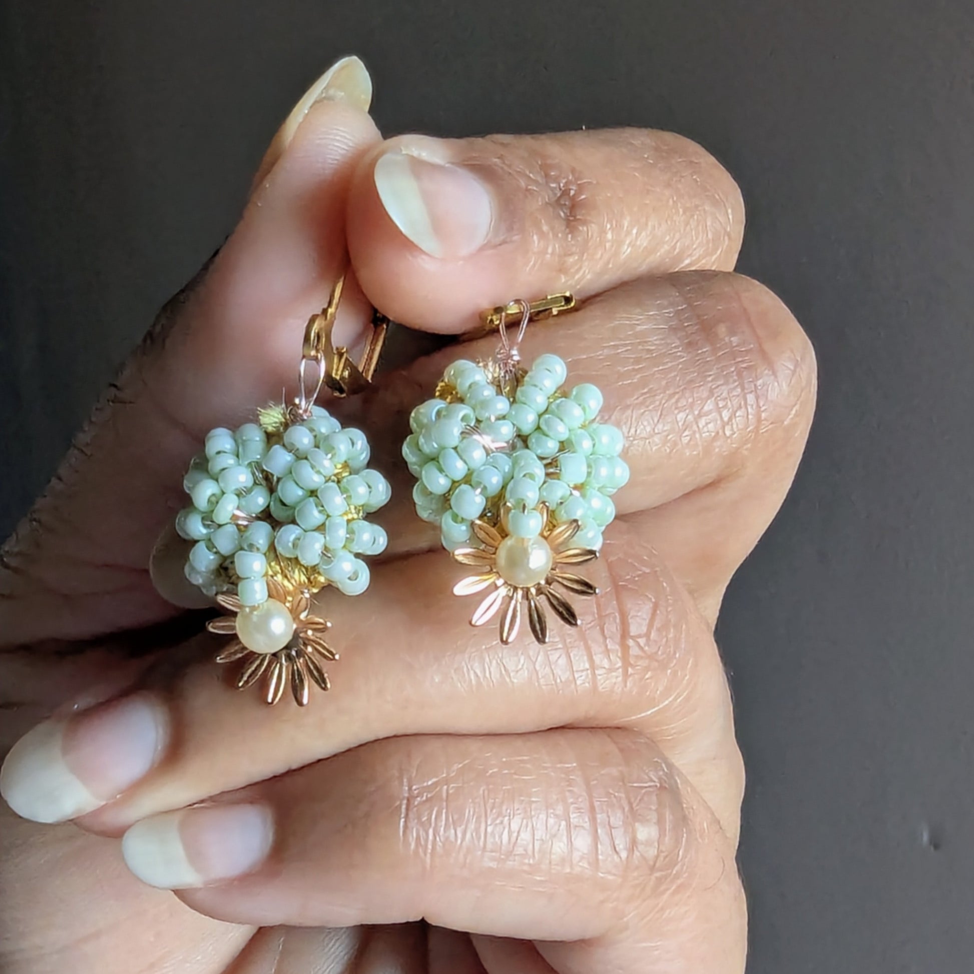 Handcrafted green and pearl beaded earrings from Mayaani Jewellery, sustainably made with intricate embroidery.