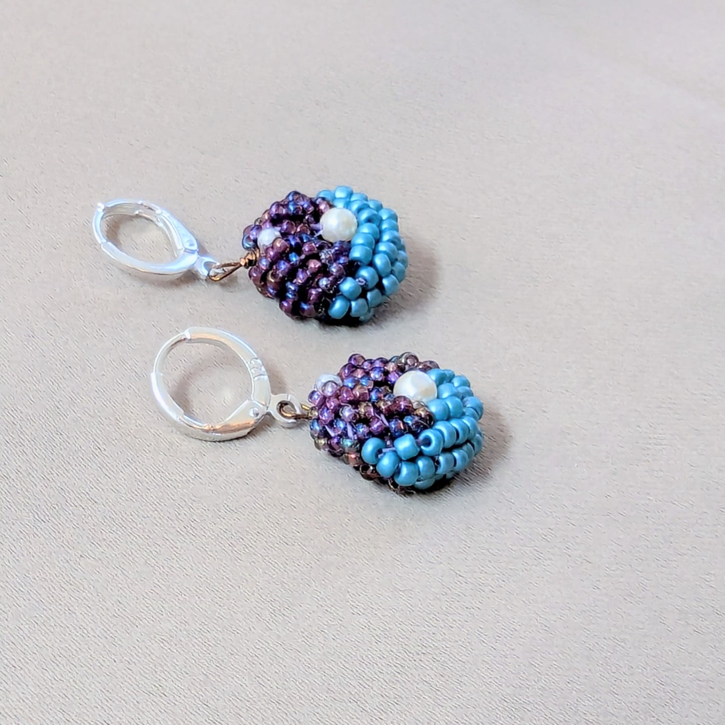 Side view of Masi Lavanya earrings revealing glass bead detailing and delicate crochet technique.