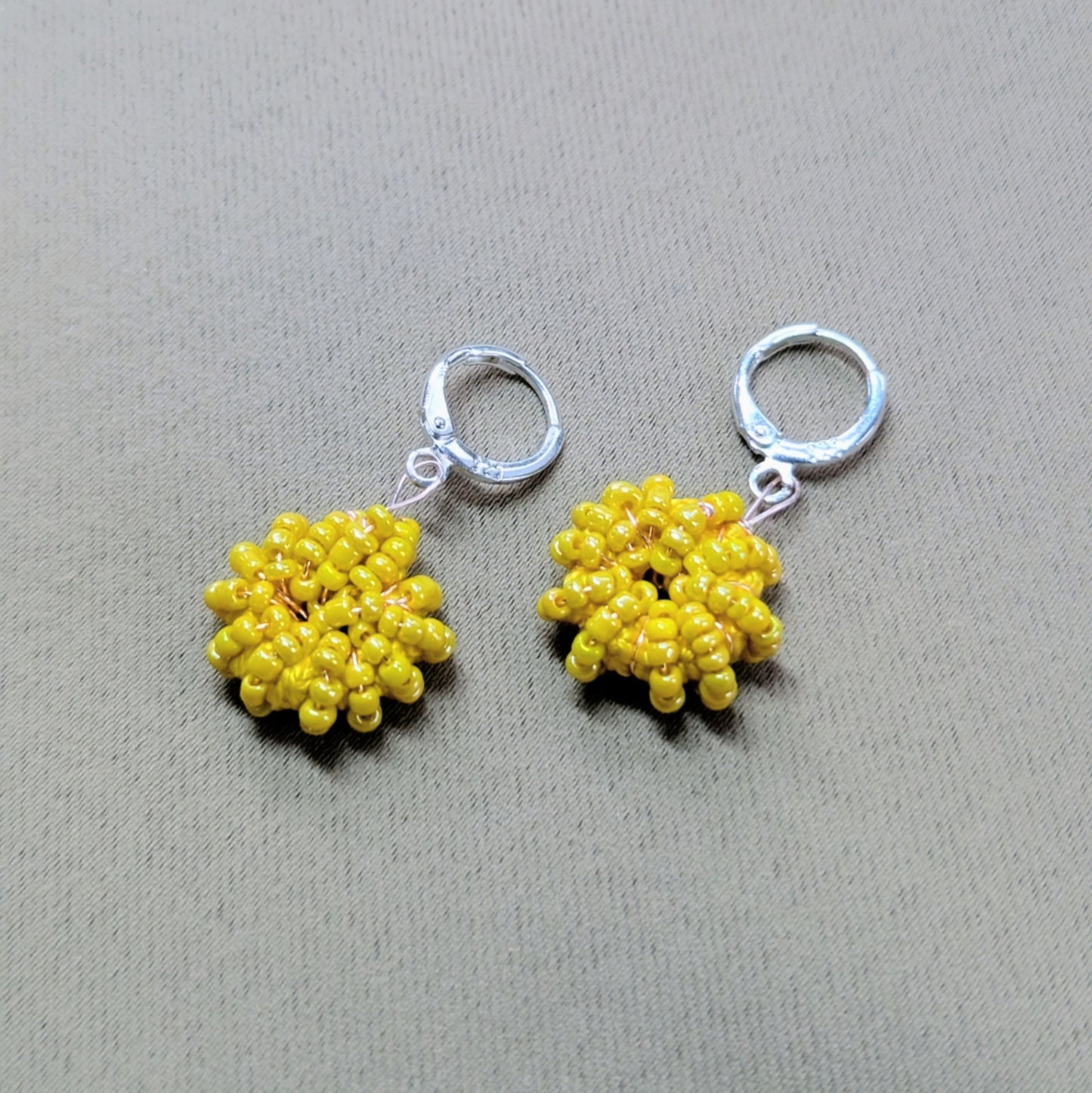 Yellow beaded hoop earrings with 925-stamped Sterling silver clasps - sustainably handmade jewellery.