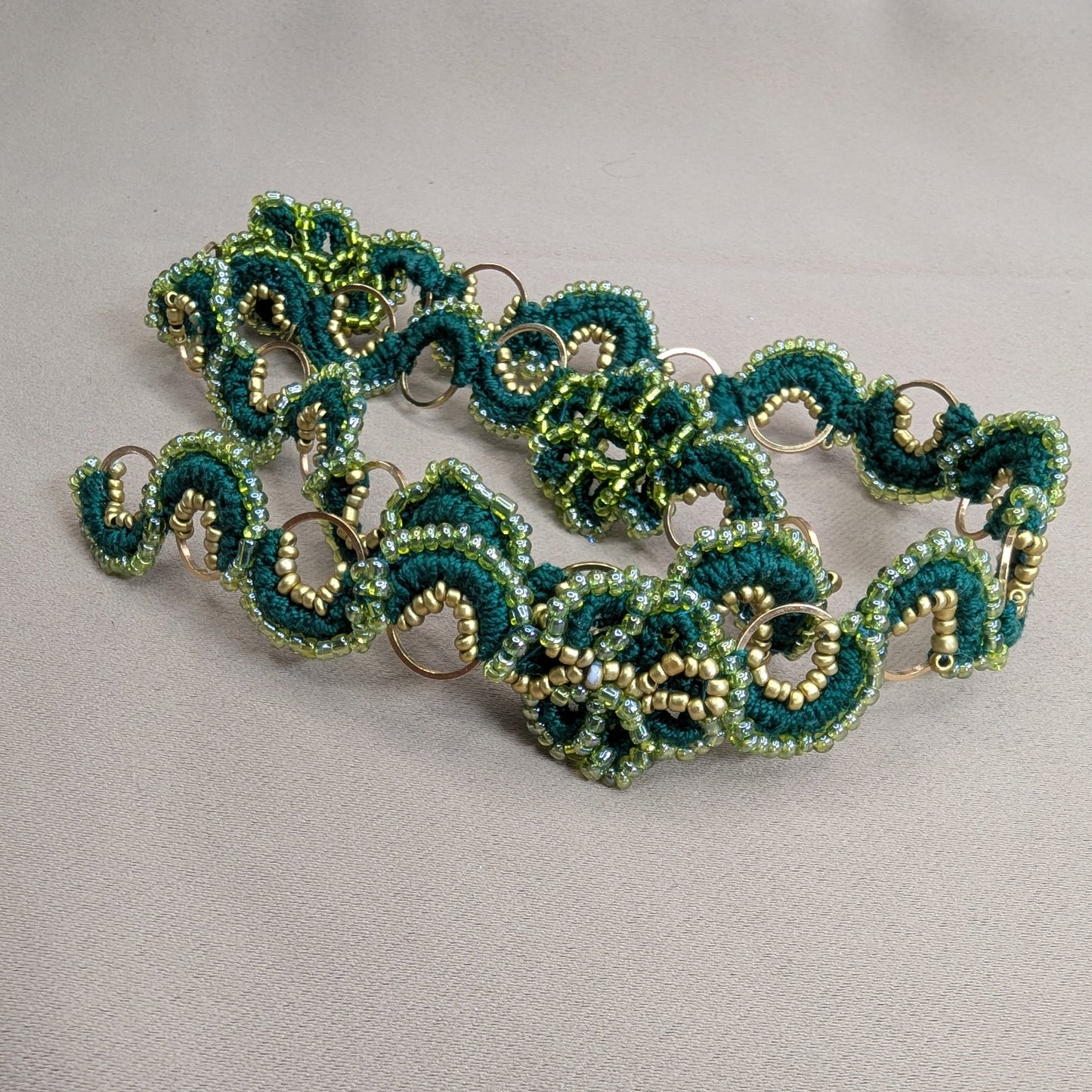 Rukmini made to order hand woven bead crochet chain in emerald green, olive green and gold.