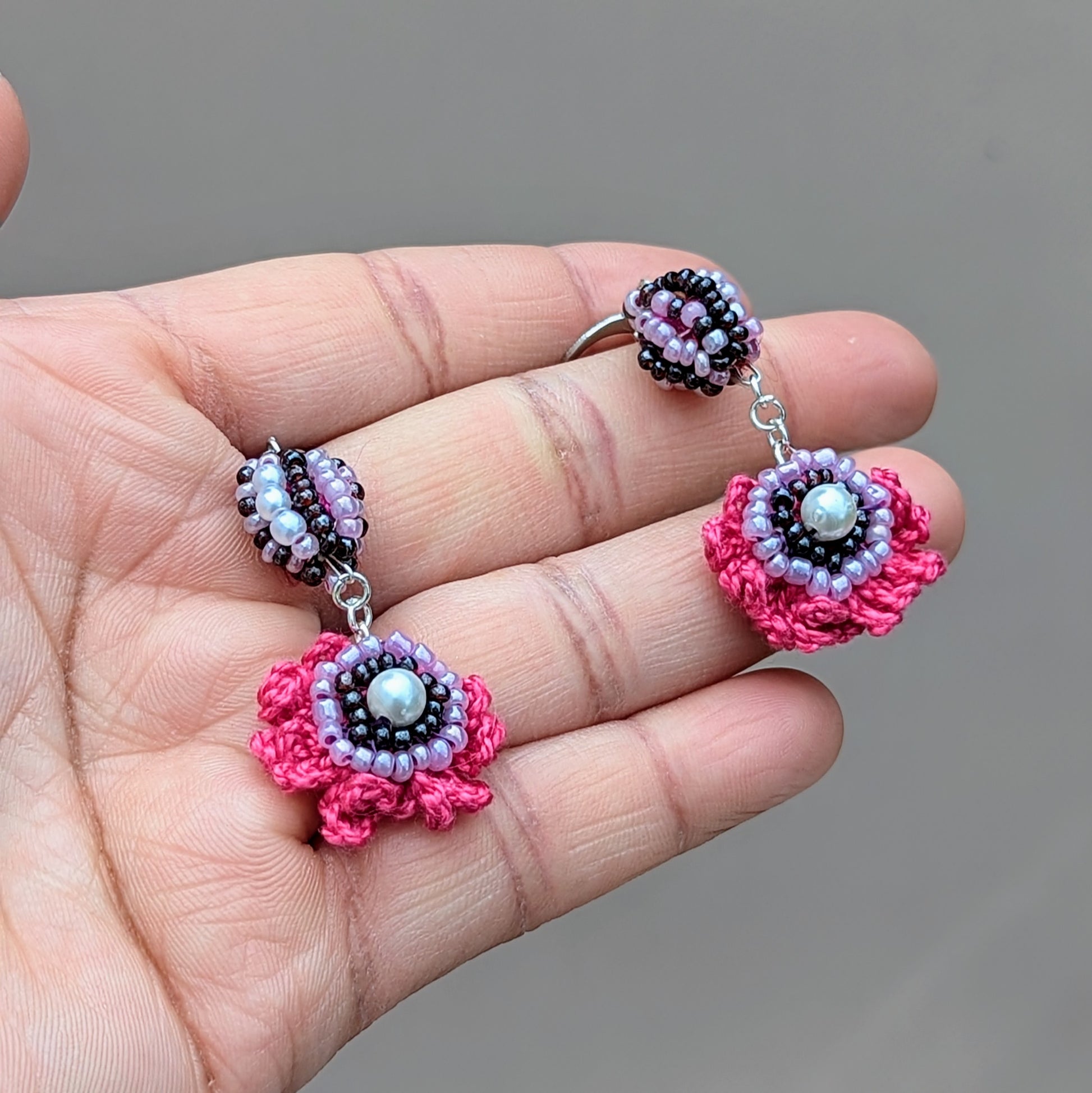 Close-up of Mayaani Jewellery earrings featuring recycled scrap beads and delicate crochet details.