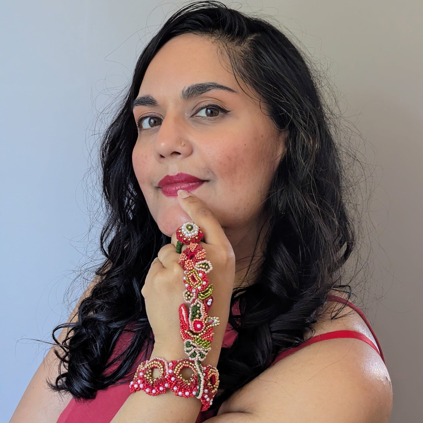 Megha of Mayaani UK posing whilst wearing the Shreya 5-in-1 Indian hand bracelet designed to separate into four pieces to give multiple options for styling.