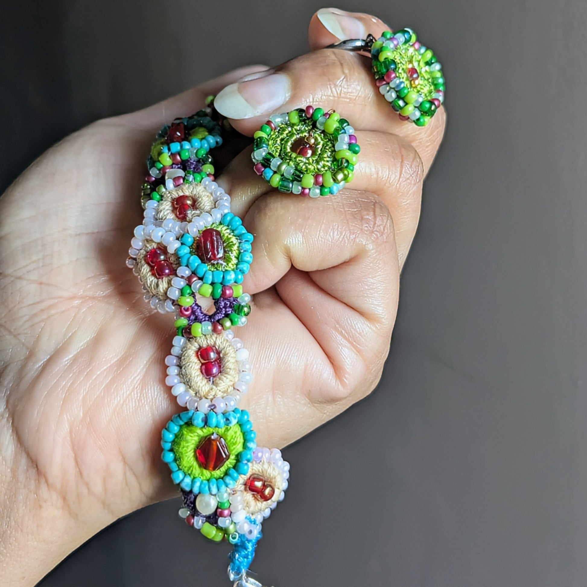 Close-up of Vana bead crochet bracelet showing floral motif and layered glass seed beads, slow-made sustainable jewellery.