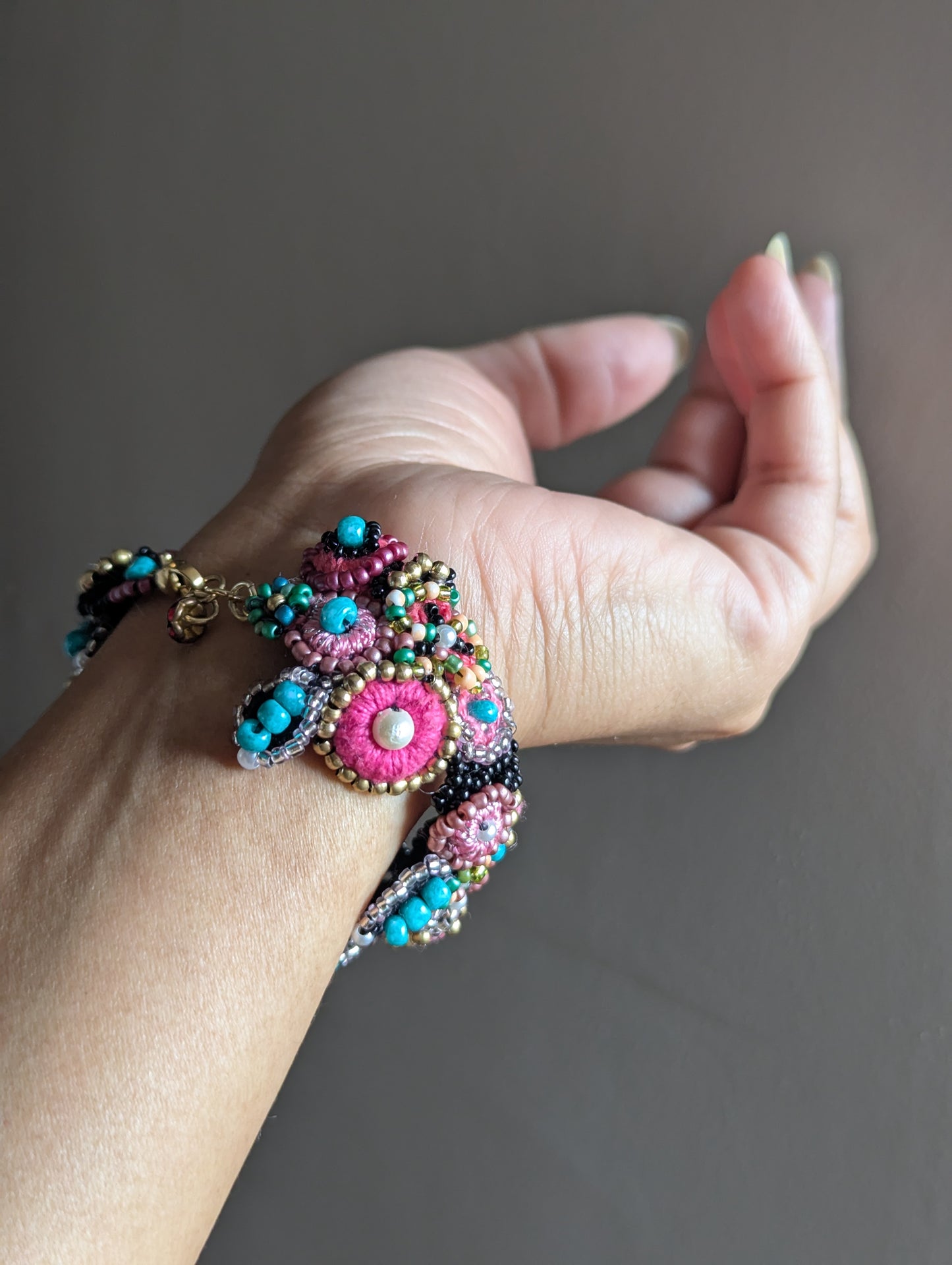 Artisan made statement beaded bracelet in black, pink, blue, gold and seed pearls exclusive to the Madhuri 5-in-1 Indian hand bracelet handcrafted for Mayaani Jewellery UK.