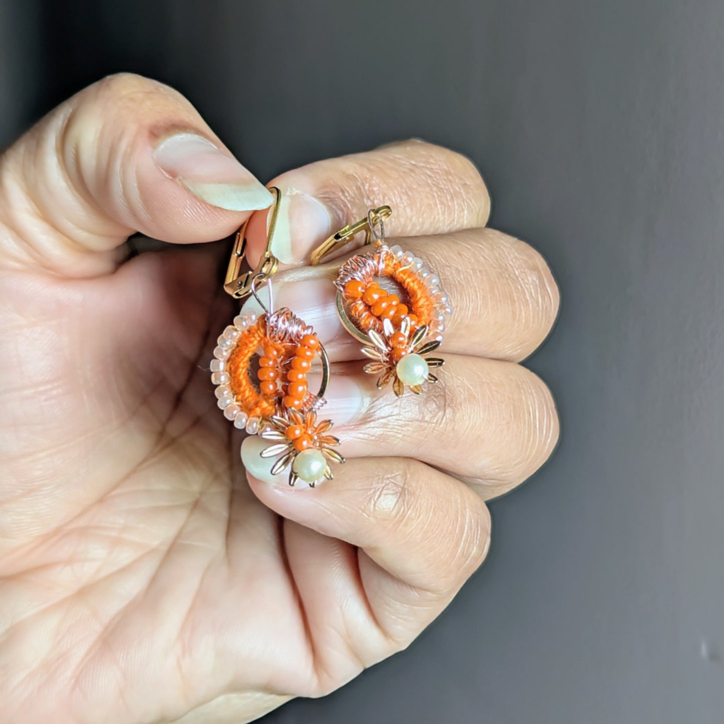 Suhasani earrings with gold stainless steel hoops and intricate beadwork.