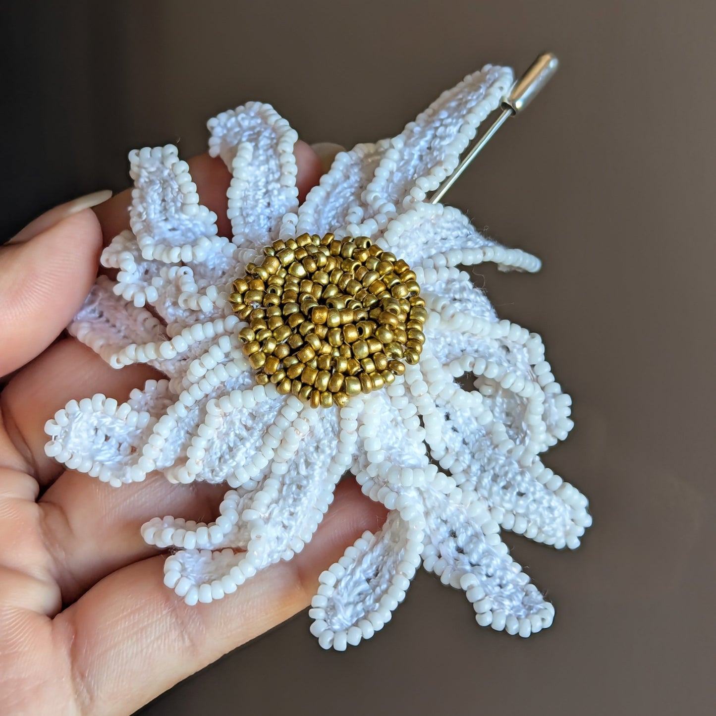 Close up view of a luxury statement daisy flower brooch pin featured in the Mayaani Jewellery Garden of Becoming series embracing different feminine energies and transformations.