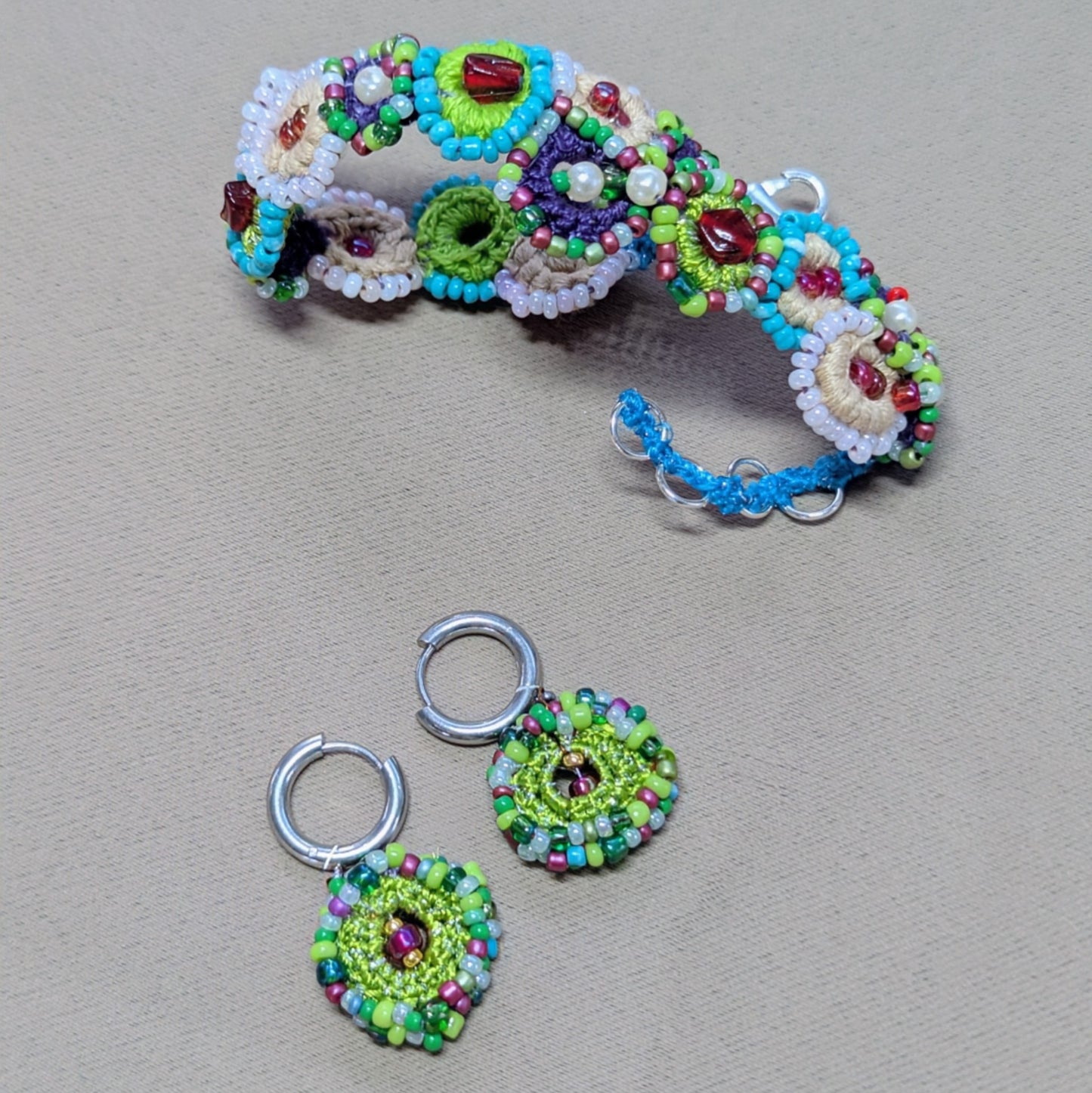 Handmade Vana bracelet and earrings set, handcrafted bead crochet jewellery inspired by a blooming garden.
