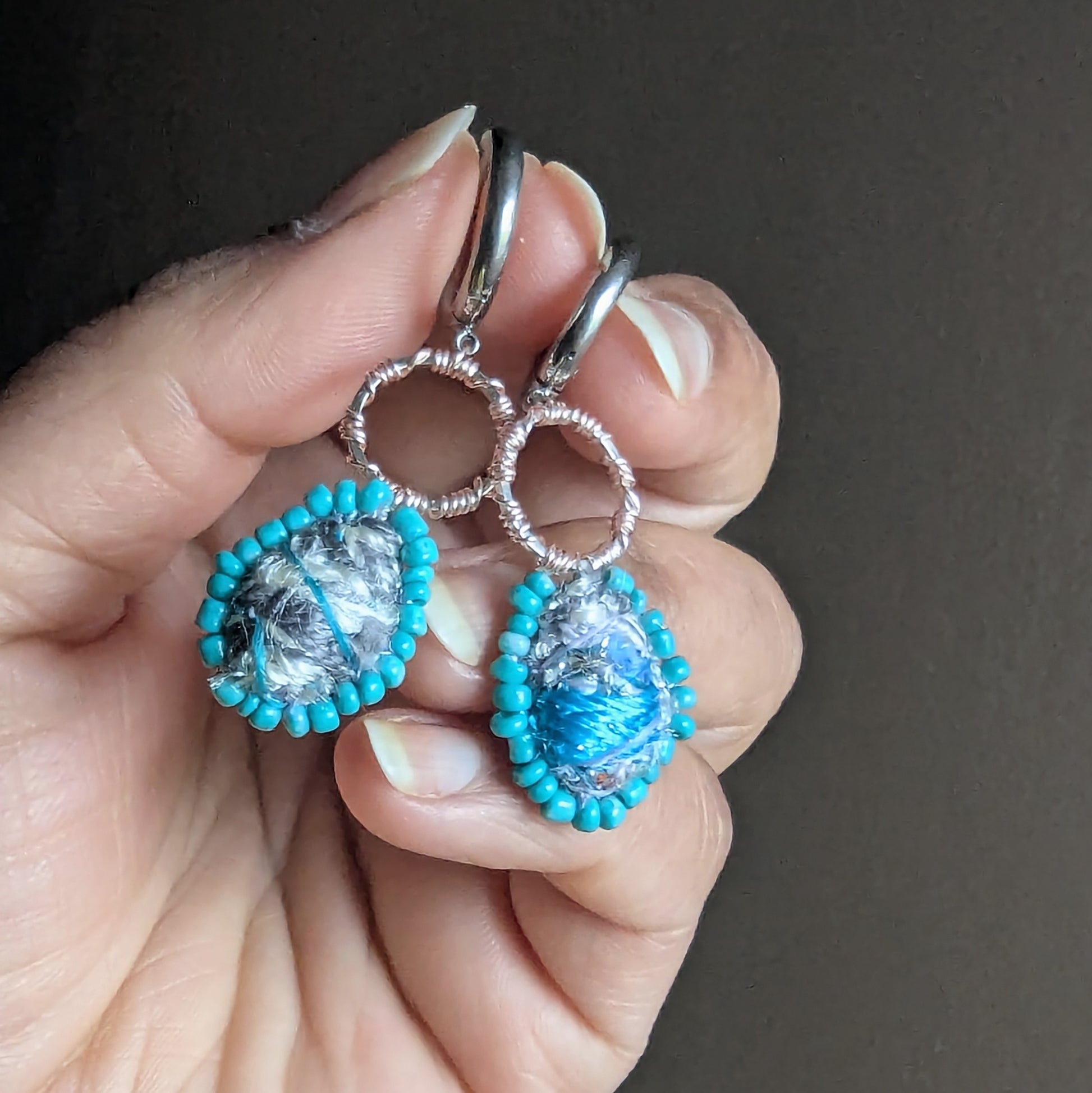 Close-up of Tarini textile art scrap bead earrings showing heirloom fabric centres and rose gold wire detailing.