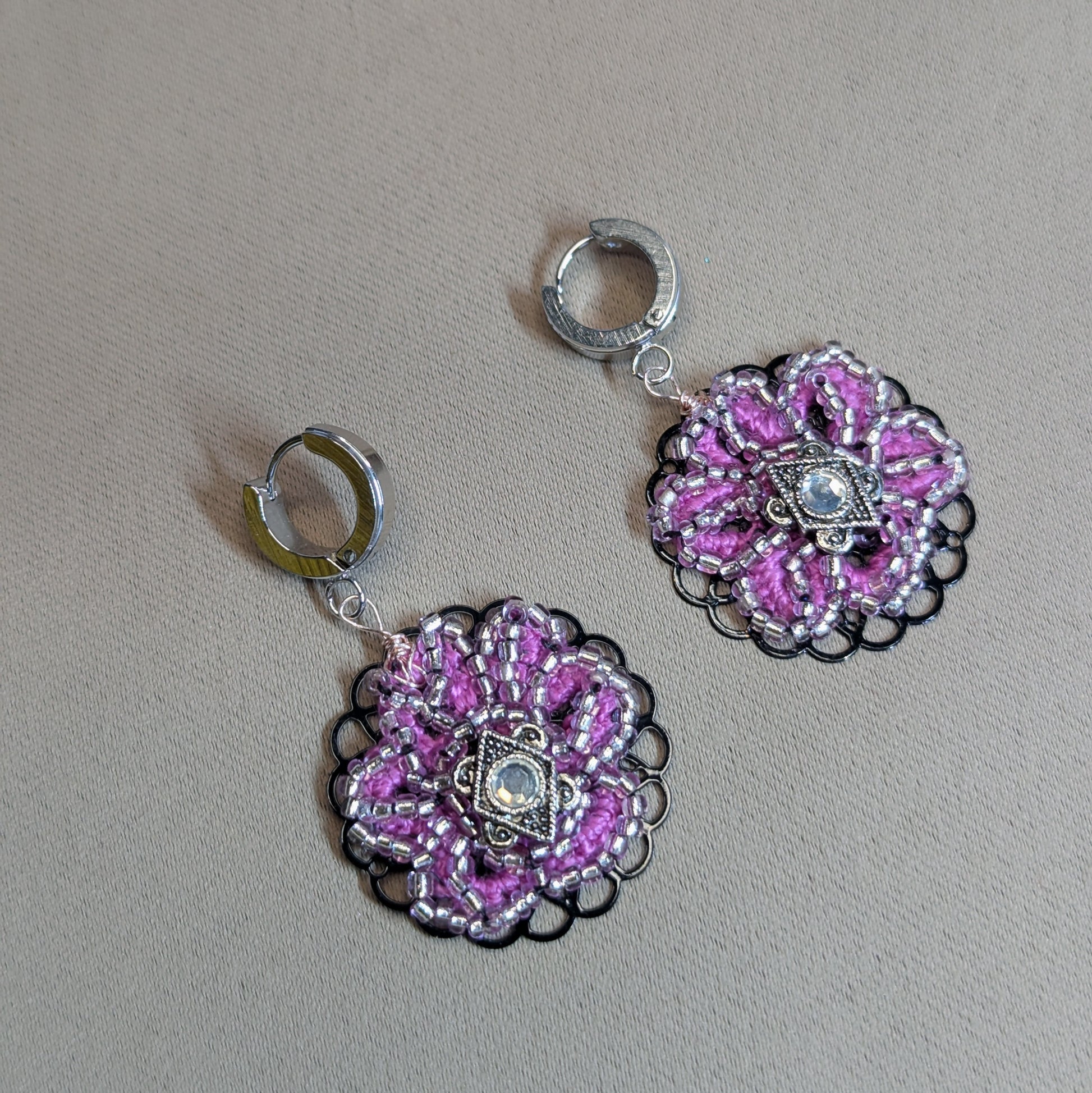 Vanya handmade pink silver lined seed bead earrings with black filigree base and vintage cubic zirconia centre.