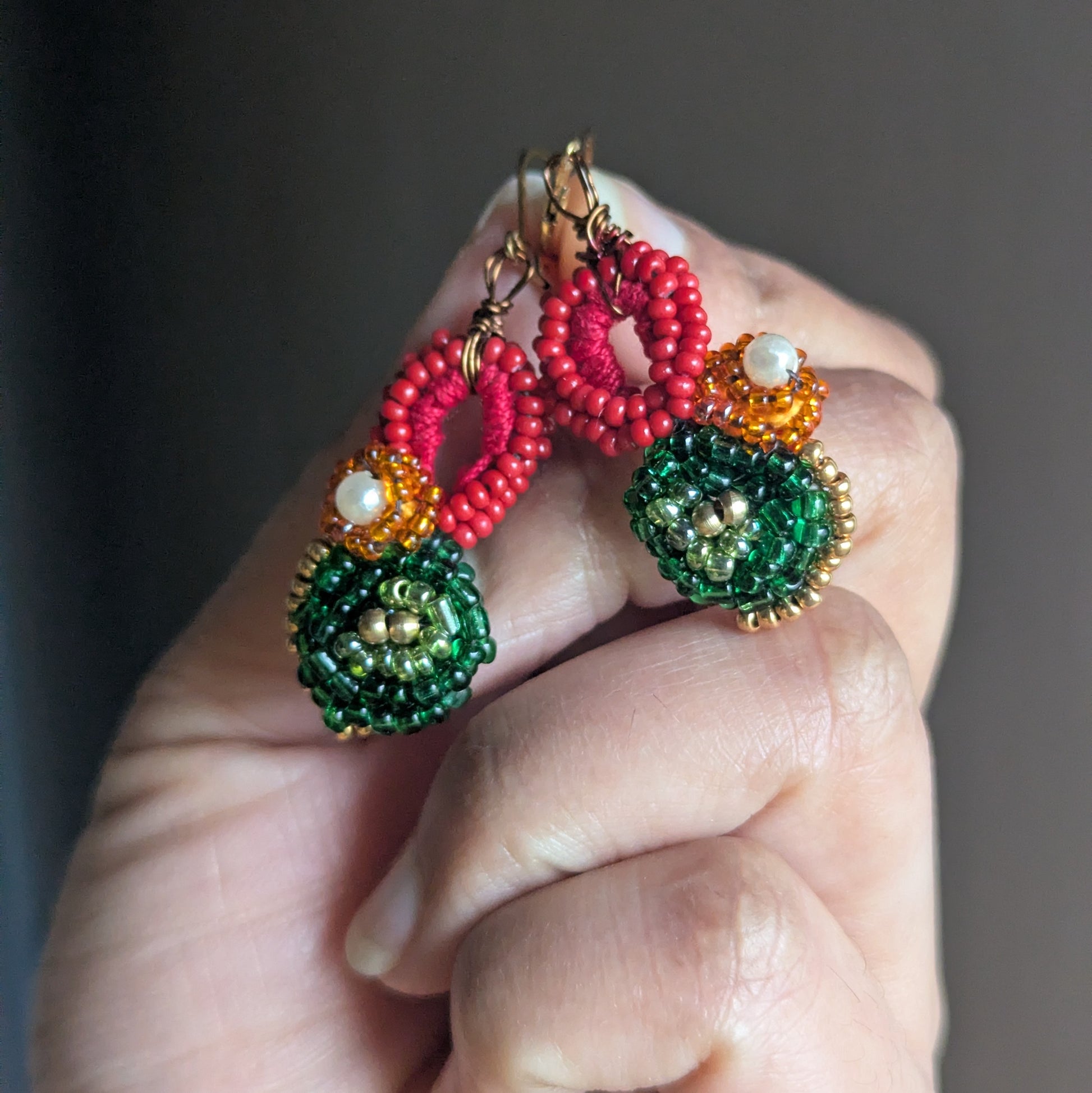 Detail of Czech glass seed beads and pearl cotton in Vasanta handmade earrings.