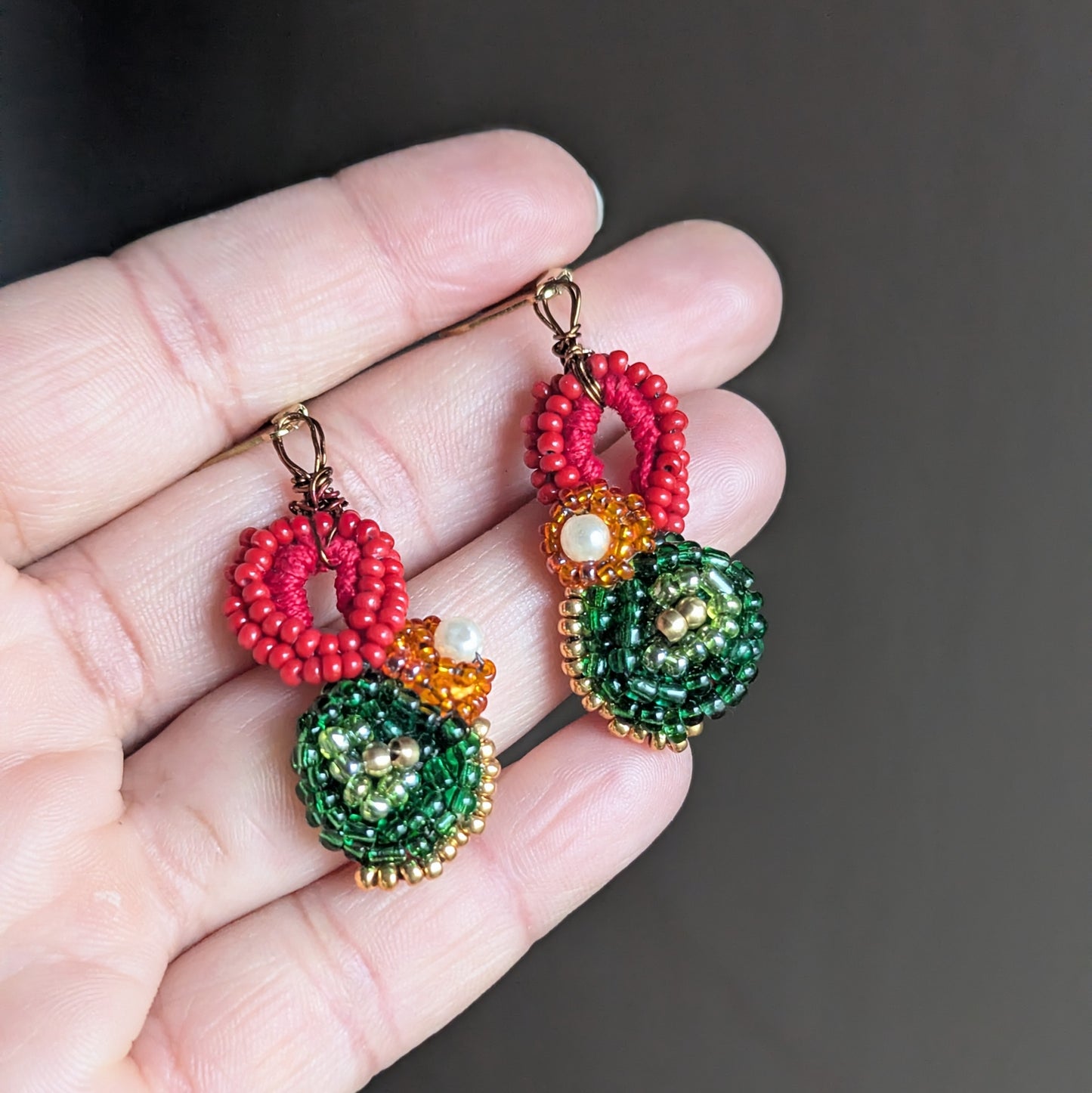 Artisan made red green and gold Indian inspired Vasanta bead crochet earrings UK.